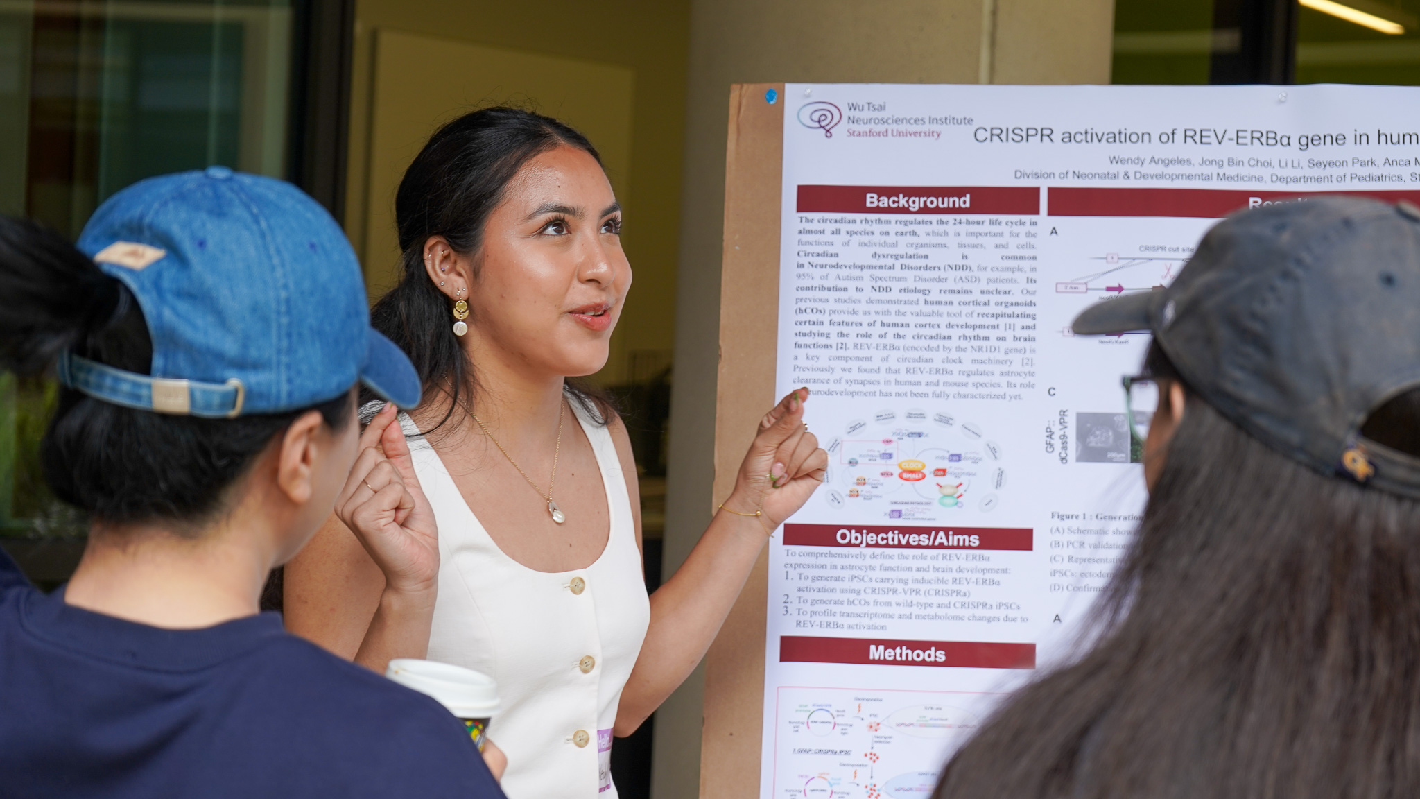 NeURO Fellow Wendy Angeles passionately discusses her research project with other neurosciencests at Stanford