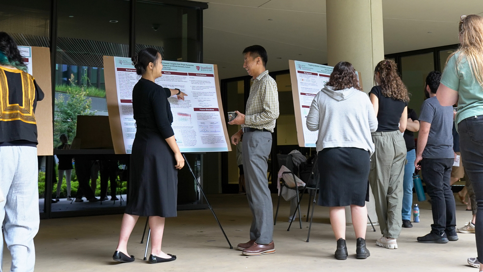 Kang Shen, Vincent VC Woo Director of Wu Tsai Neuro, discusses research at the 2024 NeURO and NeURO-CC Poster Session