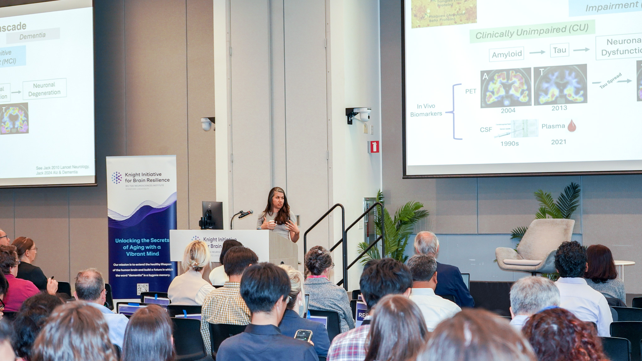 Elizabeth Mormino presents research before an audience.