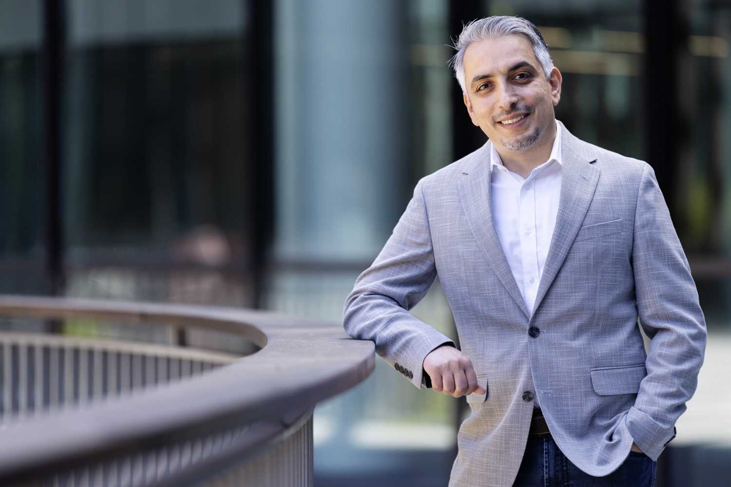 Monther Abu-Remaileh poses outside a building.