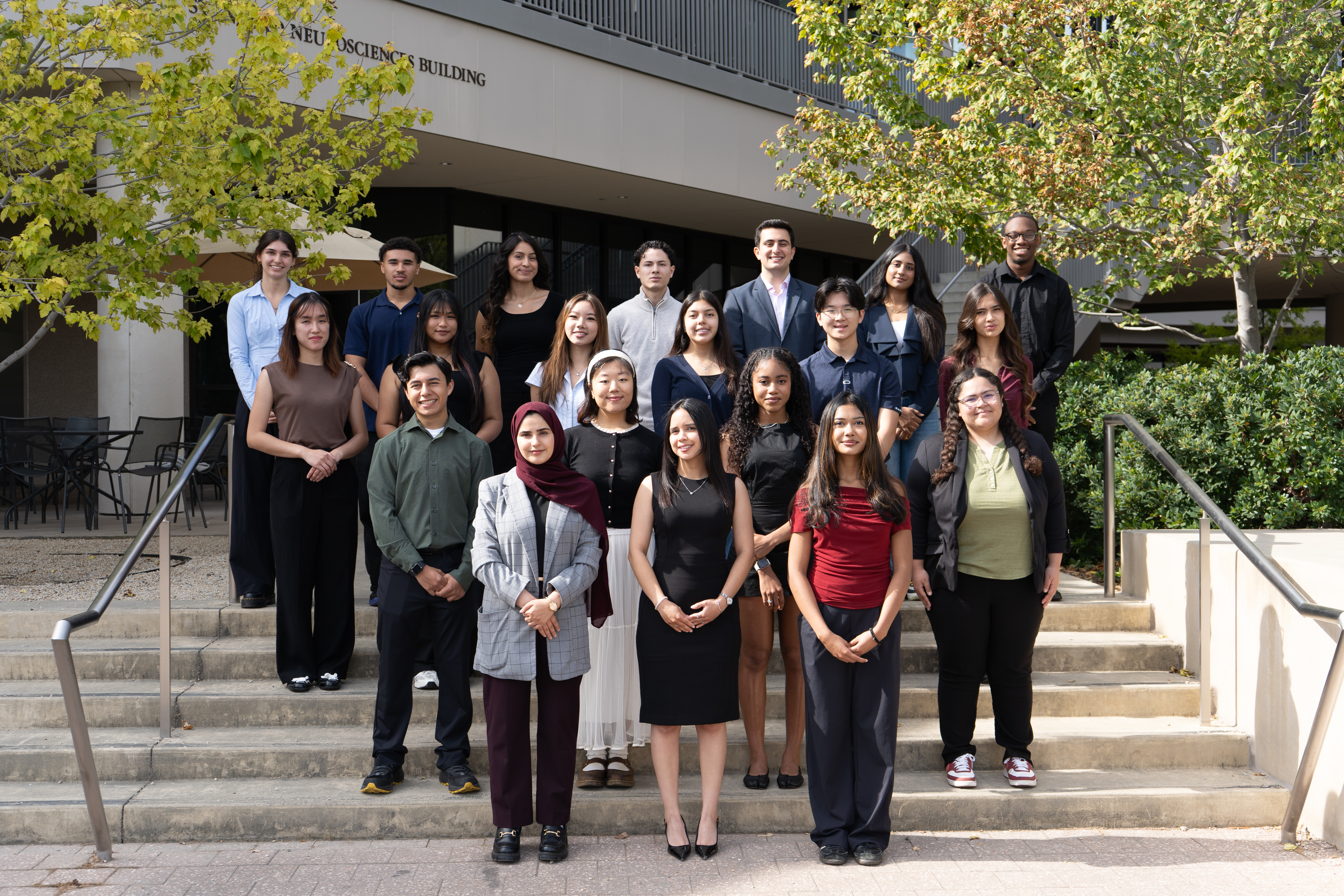 A group shot of students on a staircase.