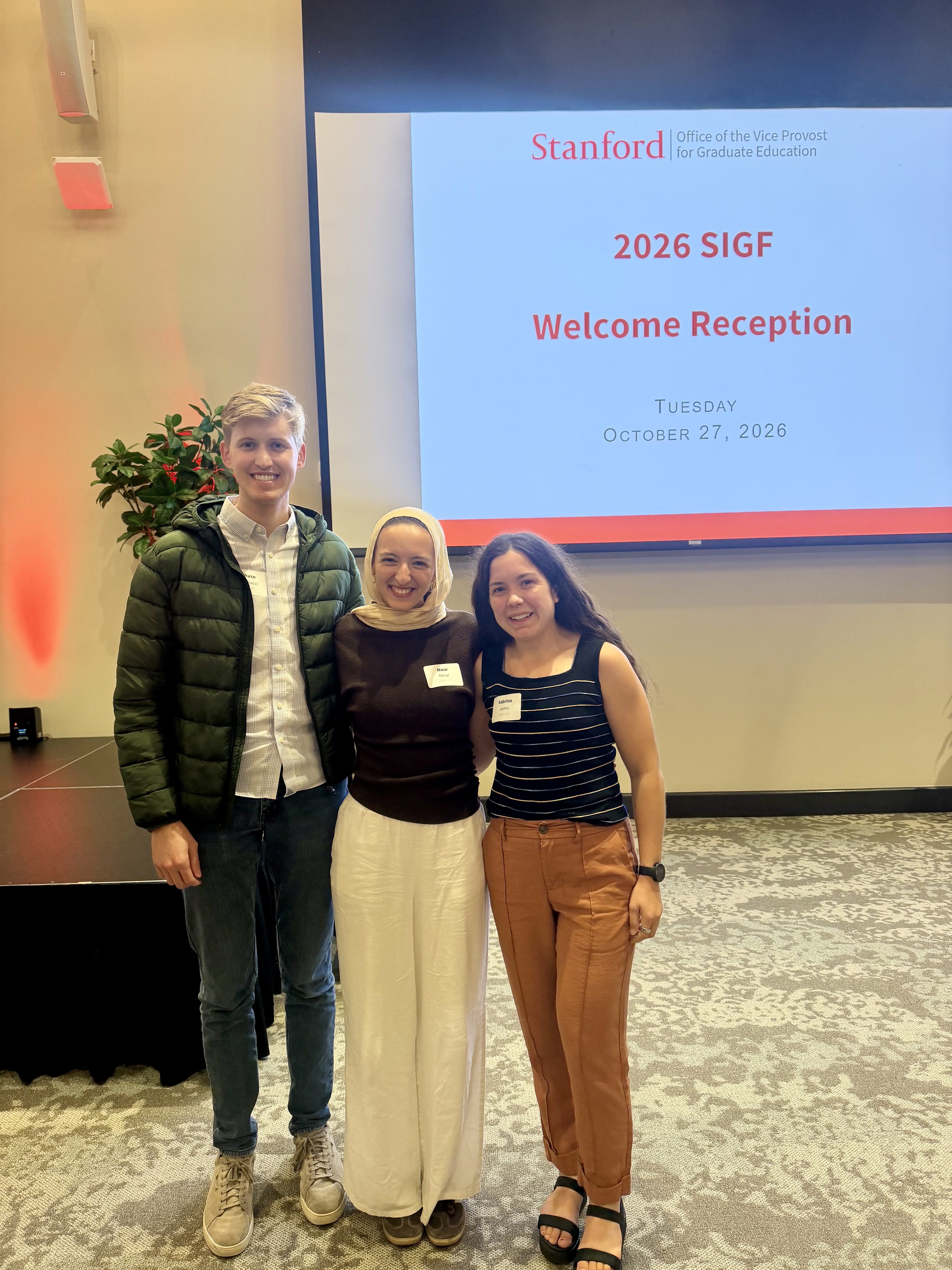 Chase Antonacci, Nour Omar, and Sabrina Jones at a reception.