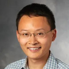 James Zou headshot against gray background