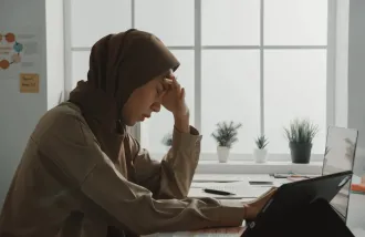 A woman showing signs of sleep exhaustion