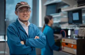 Guosong Hong and a student in his lab