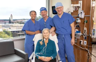 Debbie Styles smiles with her surgical team. Standing, from left to right: Tiffany, a research coordinator for the CARDIAC-PND Study, Dr. Martin Angst, and Dr. Igor Feinstein. 