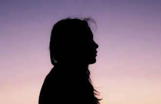 silhouette of contemplative woman