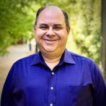 Jacob Ballon in front of greenery
