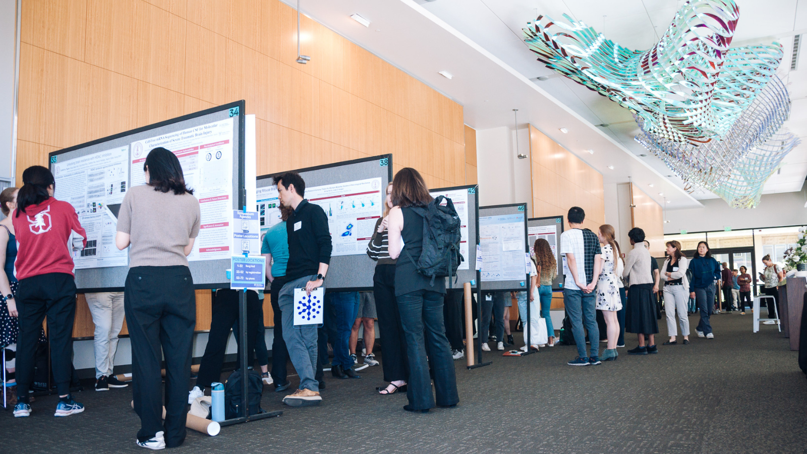 Stanford neuroscience researchers gather at the Knight Initiative's Year-End Symposium and Research Showcase at the poster session contest.  