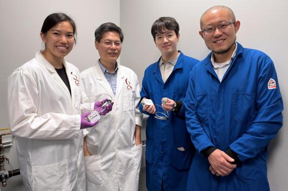 Marigold Gil Malinao, Michael Lin, Daesun Song, and Guosong Hong hold up ultrasound devices.