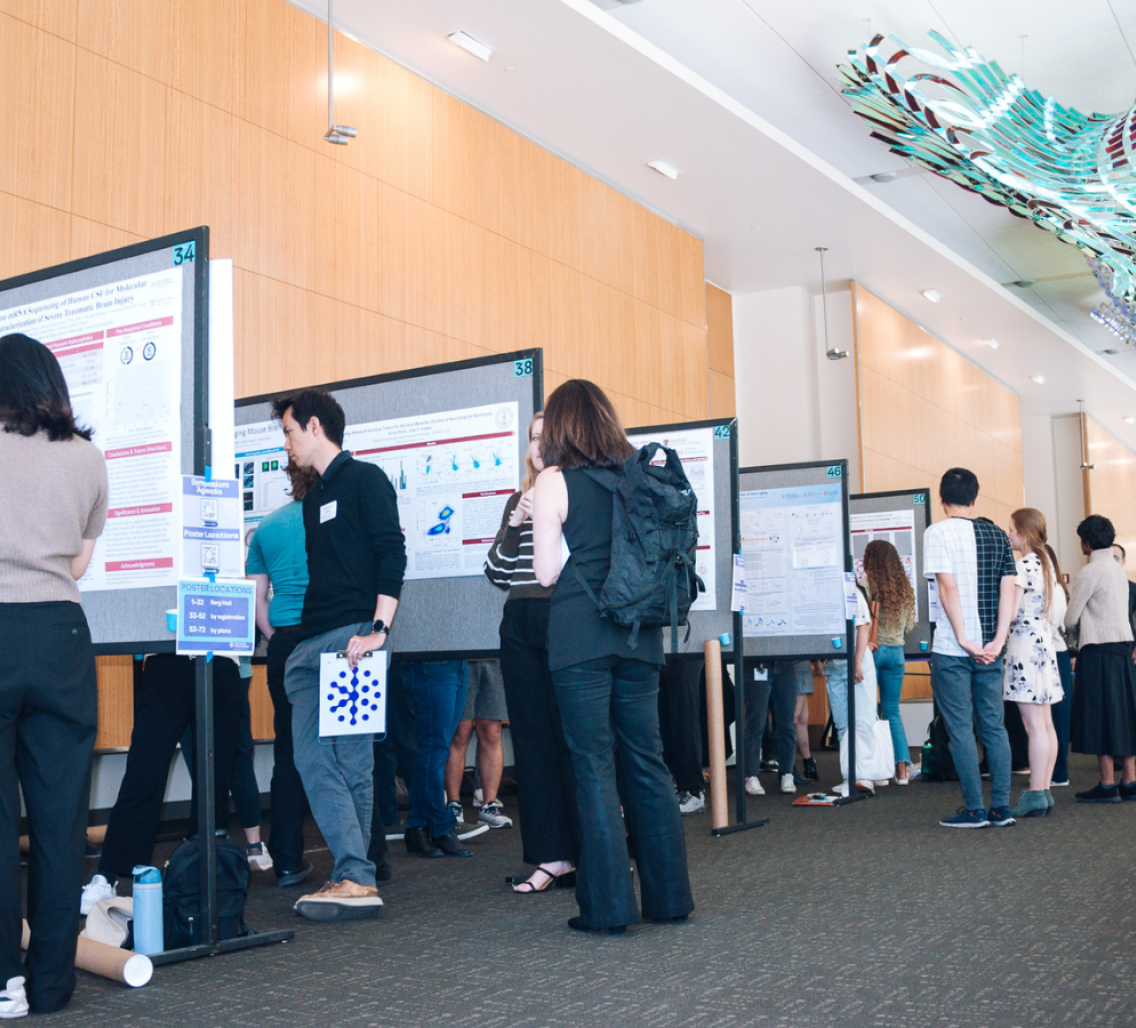 Stanford neuroscience researchers gather at the Knight Initiative's Year-End Symposium and Research Showcase at the poster session contest.  